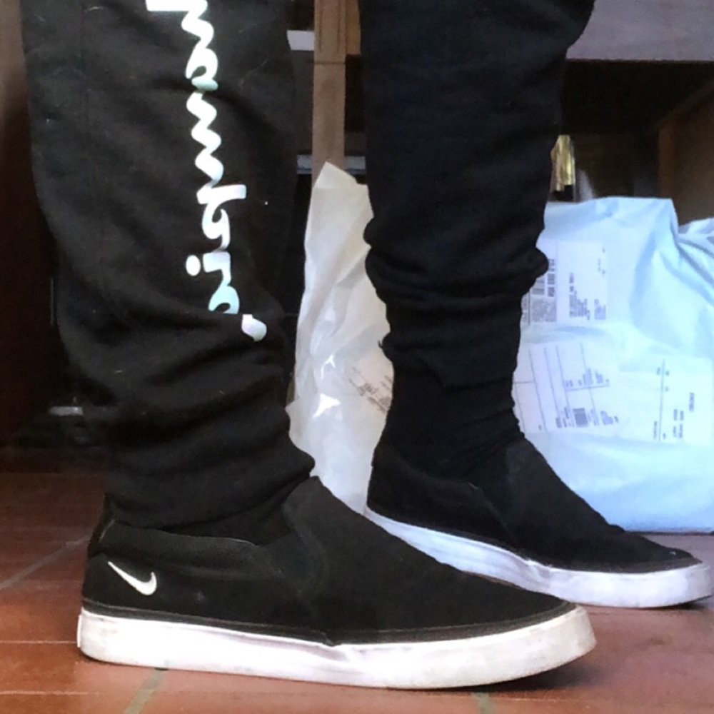 Black and white nike slip on shoes size 9.5